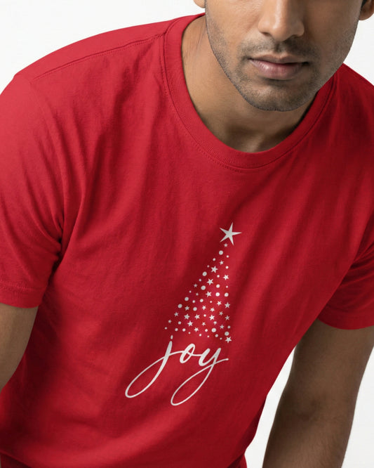 Red t-shirt with Christmas tree design and 'joy' text worn by a person